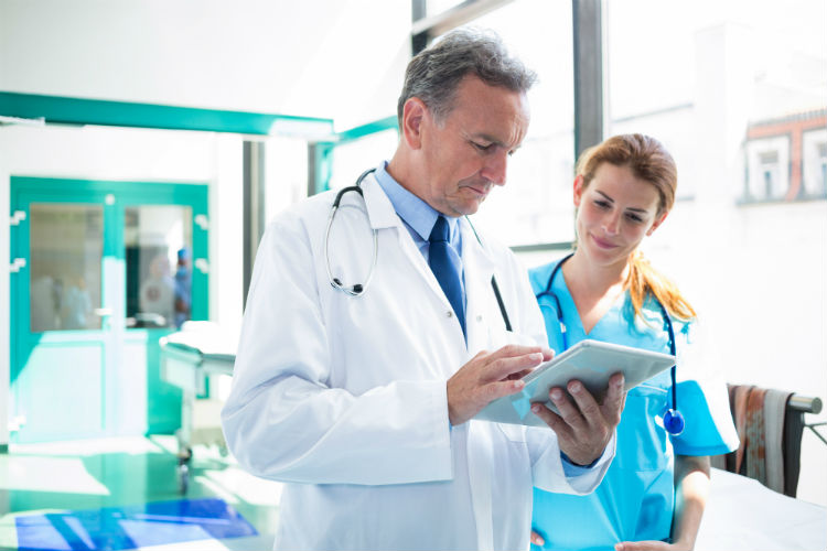 A doctor and nurse discuss How Electronic Health Records Will Change Healthcare