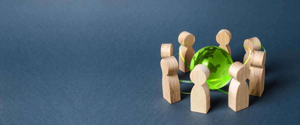 A group of figurines around a globe symbolize private equity outsourcing.