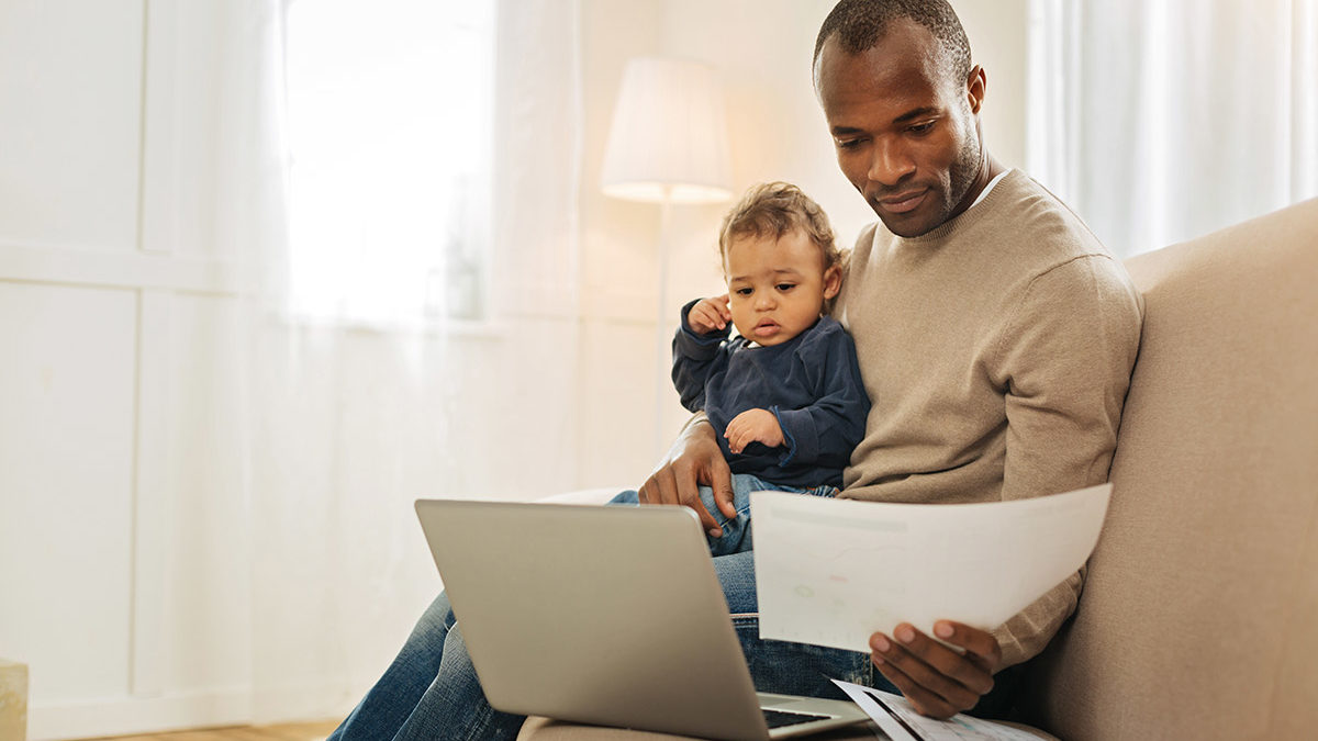 father reviewing financial plan