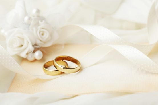 bigstock two wedding rings and wedding 346457053 1